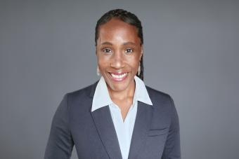 Headshot of Ashani Johnson-Turbes, Ph.D., Vice President and Director of the NORC Center for Equity Research. A Black woman with her hair pulled back wearing a dark gray blazer and white collared shirt.